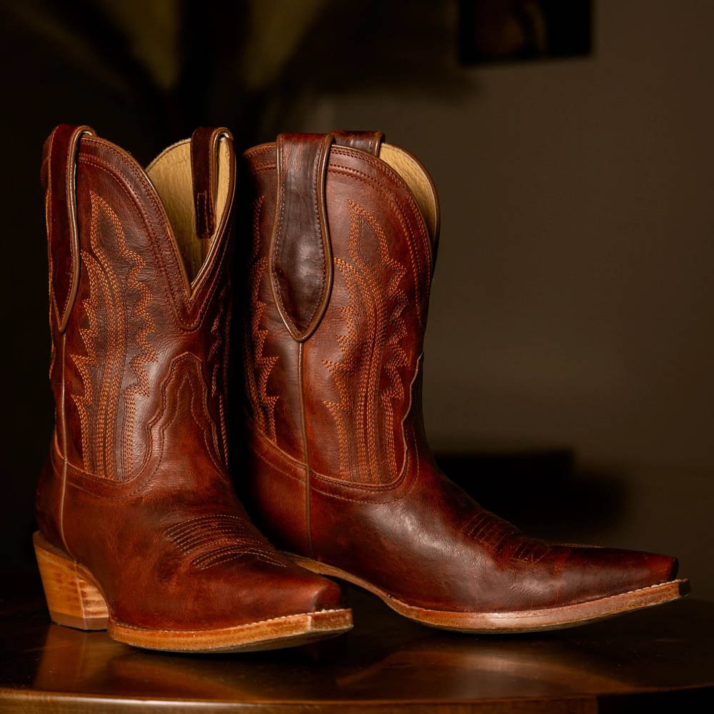 Featuring the Areli 9" Bootie in brown.